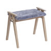 En sittpall från oscarsons möbel. Pallen heter Alme och finns med dyna i fårskinn och fårskinnslook.