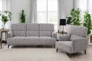 Amelie är en högryggad soffa med pocketsits. Går att få i både tyg och skinn.